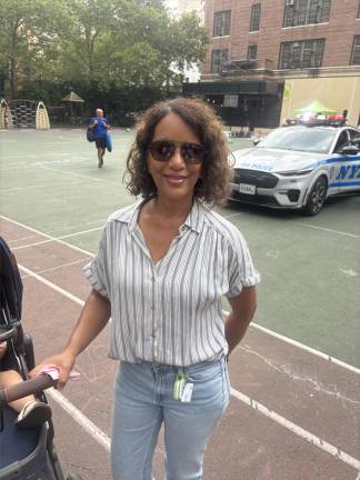 Nora Tranquada was minding two kids and was pleasantly surprised to find Catherine’s Park had been taken over for the 19th Precinct’s Night Out on Aug. 5. “It’s a wonderful event,” she said.