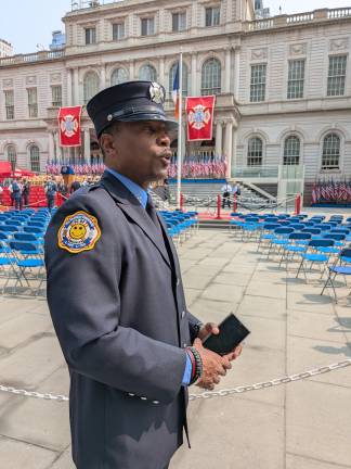 FDNY Medal Day 2025. A firefighter in dress blues arrives early.