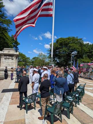 Standing for the national anthem.