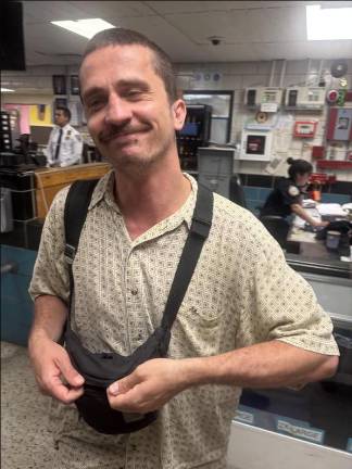 <i>Daily News</i> reporter Christopher Sommerfeldt, at the 115th Pct in Jackson Heights where Mayor Eric Adams held his off-topic press briefing on June 24. Adams let Sommerfeldt take a seat at the weekly press briefing after threatening to bar him a weekly earlier for speaking out of turn. But Adams still refused to call on him.