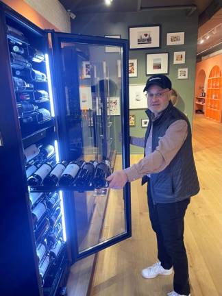 GM Mark Selig shows off one of the store’s wine coolers.