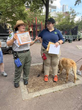 Urban Park Rangers talking Manhattan water outside Columbus Park on Baxter Street.
