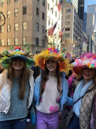 The Cottingham family flew in from Dallas, Tex. to join the Easter Parade outside St. Patrick’s cathedral on April 9 as Ava (far left) celebrates the birthday of her sister Sterling (center) sporting bonnets designed by their mom Melissa (right). Photo: Keith J. Kelly