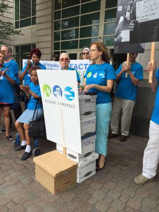 Pledge 2 Protect activist Jill Eisner delivering boxes of letters opposing the East 91st Street marine transfer station to the state Dept. of Environmental Conservation.