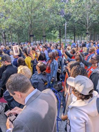 Listening to the reading of the names.