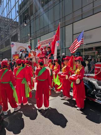 Bright colors and hand drums at the AAPI Parade.