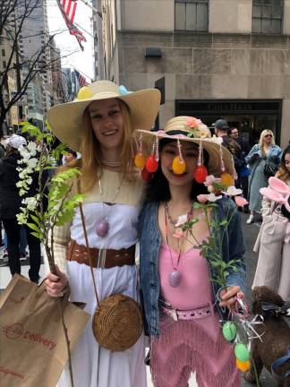 Kirsten (left) from Brooklyn was attending her first Easter Parade with her friend Cecilia, originally from China. They said it took about four hours to created their bonnets. Photo: Keith J. Kelly