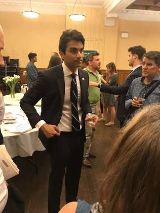 Suraj Patel mingles with voters at a town hall on May 24 in an East 88th Street church. Photo: Douglas Feiden
