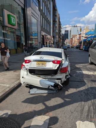 Another crash: An allegedly stolen Infiniti Q50 on Sunday, July 20, near the northwest corner of Bowery and Canal Street. Note that the car is facing the wrong way.