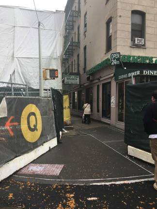 Fencing and machinery surround the businesses on Second Avenue at E. 86th Street, where subway construction is in full swing. Photo: Madeleine Thompson