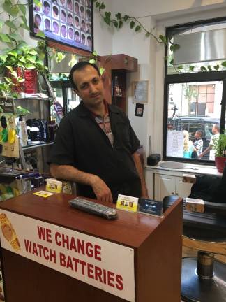 Steve Badl, who owns Unique Cut Barber Shop, moved his store about 10 blocks north, to East 96th Street, when Extell bought his former First Avenue location, near 86th Street. Photo: Ben Schneier
