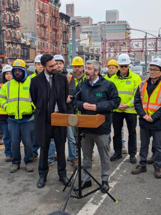 DOT Commissioner speaking at Williamsburg Bump begone event as Hizzoner watches.