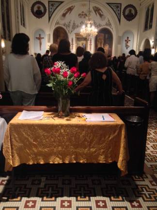 Services at Our Lady of Peace the evening before the church on East 62nd Street was closed on July 31. Photo: Richard Khavkine