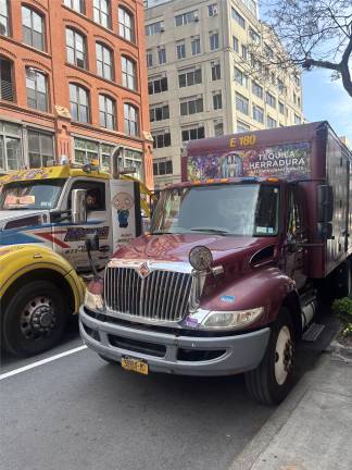 The rear wheels of this tequila delivery truck struck the head of George Smaragdis after he was doored by the driver of a parked Mercedes Benz. The truck driver and driver of the van remained on the scene and no arrests were made, police said.