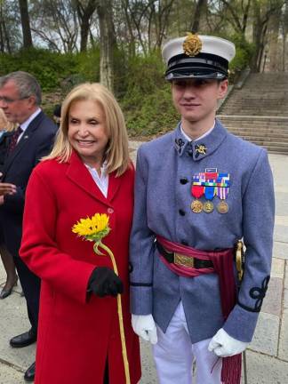 Knickerbocker Greys cadet Ian Bell posed for a photo with Congresswoman Carolyn Maloney at a vigil for Ukraine on April 18. Photo courtesy of Adrienne Rogatnick