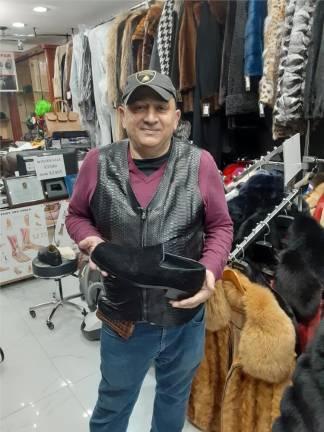 While the sign above the door says “Rafaello Furs,” the proprietor, Rafael Allayev, has a special affinity for shoes. He learned the cobbler trade from his father, growing up in Tajikistan.