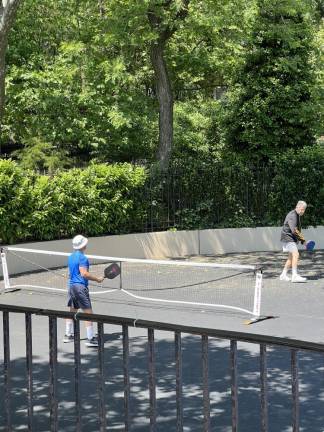 Community Board 8 voted to set aside room for three pickleball courts, with the Parks Department recently applying a new coat of paint for them. Now, some local residents have set up a fourth court on their own, angering other residents who say open space for kids is being taken away. Photo: Jack Ahern