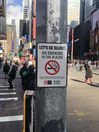 About a dozen signs have been posted since mid-December, according to Times Square Alliance President Tom Harris. Photo: Keith J. Kelly