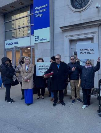 A group calling itself the East Side Accountability Alliance, plus GOP State Senate candidate Alina Bonsell (left, tan coat), rallied on March 18 against the planned opening of a homeless shelter on First Ave.