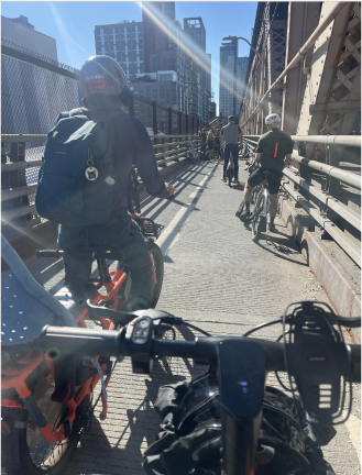 Bicyclists during aftermath of the collision. On Queensboro Bridge facing Queens.