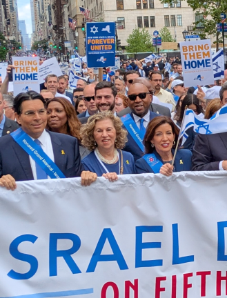 Governor Kathy Hochul (right), Attorney General Letitia James (second from left), and others.