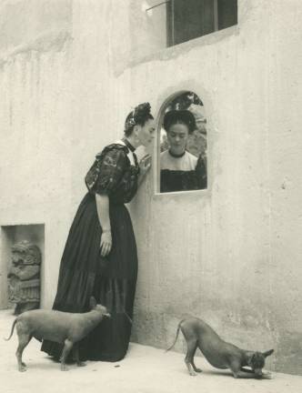Lola Alvarez Bravo. &quot;Frida Looking Into Mirror With Dogs,&quot; c. 1944. Courtesy of Throckmorton Fine Art.
