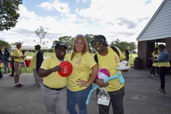 Denise Flores (center) with Deon Williams and Corey Brashear, two residents from The New York Foundling's Laconia residence, during a BBQ in 2019.