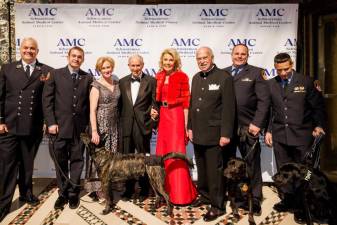 At the 2022 Top Dog Gala, with (at center) CEO Kathryn Coyne, Stephen and Christine Schwarzman with FDNY K-9 unit. Photo: Brian Dorsey Studios