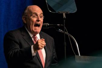 Former Mayor Rudolph Giuliani, seen here introducing Donald Trump at a 2016 campaign event in Iowa, has cemented his role as the president's loudest and most combative supporter.