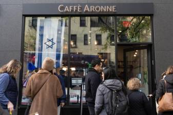 Outside Caffe Aronne, a long line of supporters that stretches across the block. (Priyanka Rajput)