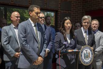 Assembly Member Grace Lee speaking at a press conference announcing $2 million from state budget to support health research for first responders following exposure to 9/11-related diseases. Pictured are also Manhattan Borough President Brad Hoylman-Sigal, Dr. Amit Verma, Dr. David Prezant, Tammy Meltzer, and Jim Brosi.