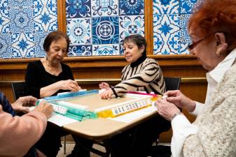 Friends enjoy a table game at 92Y’s Hiram Brown program before the pandemic. Photo courtesy of 92Y