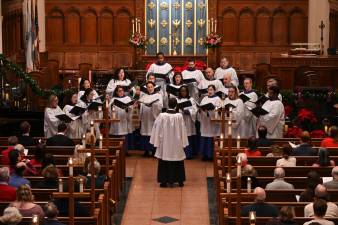 Brick Church Music Director Dr. Raymond Nagem leads the choir in traditional holiday song, including “The Saviour of the World Is Come,” a world premiere composition by Daniel Ficarri.