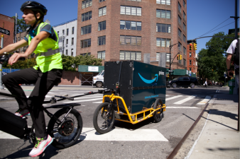 A rider with an electric bike such as those powered by lithium batteries delivers cargo in NYC. Photo: Bicycling.com