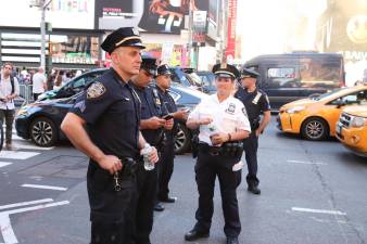 Police in Times Square in June. Photo: Elvert Barnes, via flickr
