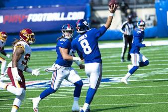 Daniel Jones tossing a pass against the Washington Football Club, has been plagued by turnovers especially his first few seasons. Now he’s entering his fifth season and pressure is on to make something happen. Photo: All-Pro Reels Photography, Wikimedia Commons
