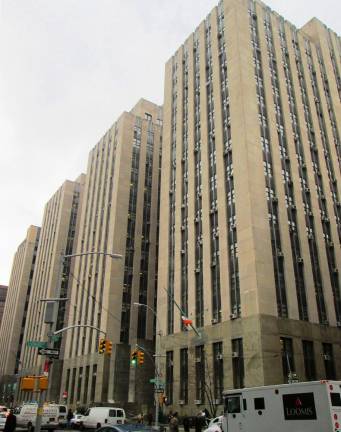 Michael Olson, a 54 year-old financial executive, has been indicted by the Manhattan D.A.’s office for allegedly grooming--and then repeatedly raping--a 14 year-old girl over a six-month period at various hotels. Pictured: The New York City Criminal Courts Building at 100 Centre Street.