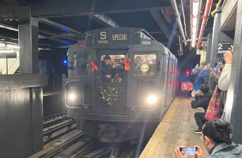 At the Second Avenue - Houston Street station on the F line, the Nostalgia Train ends another round trip, soon to wait for another journey uptown. At each end of the trips, there is usually a pause for picture taking.