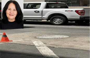 A manhole cover sits near East 52nd Street and Fifth Avenue in Midtown Manhattan following the death of Donike Gocaj, 56, who authorities said fell into an uncovered manhole after stepping out of her vehicle Monday night, May 18, 2026, in New York. Investigators are continuing to examine the situation.
