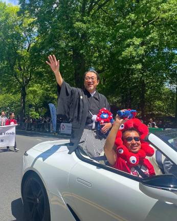 Grand marshall at this year’s Japan Day parade was Iron Chef Masaharu Morimato, who waves to parade goers as he rolls up Central Park West.