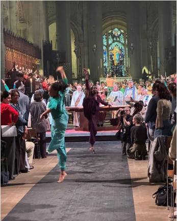 Exuberant dancing in the aisles is part of the celebration of St. Francis of Assisi at the Cathedral of St. John the Divine.