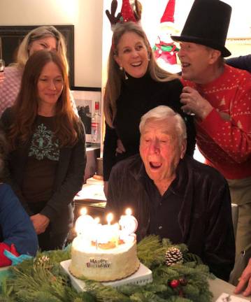 George Capsis celebrating his 92nd birthday with friends and family.