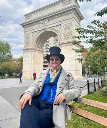 Here’s looking at you. Adam Pajkowski in a “history bounded” outfit top hat in repose at Washington Square Park. Photo: Sophie Collongette