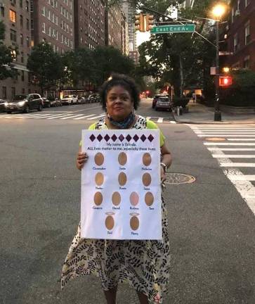 Erlinda Brent poses with a sign she made for a Black Lives Matter vigil in June 2020. Photo courtesy of Erlinda Brent