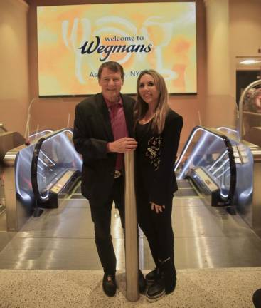 Chairman Danny Wegman and Paula Kerr Jarrett, his wife, attending the grand opening of Manhattan’s first Wegman’s. It has replaced a K-Mart at Astor Place.