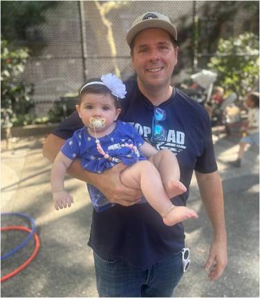 Michael Naughton was enjoying his day off from his duties as a police officer in Brooklyn to bring his two daughters to National Night Out to Fight Crime for the 19th Pct. at St. Catherine’s Park on the UES.