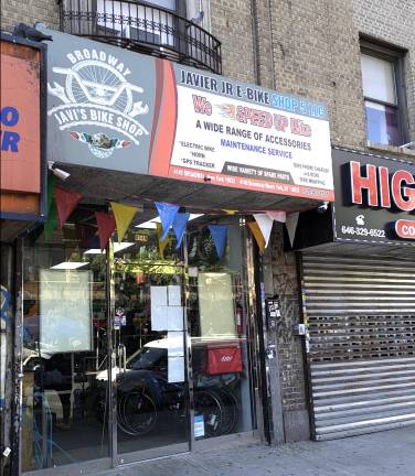 The City Council is launching e-bike safety review in part to deal with issues like speeding e-bikes. Here a Washington Heights shop advertises “We speed up bike.”