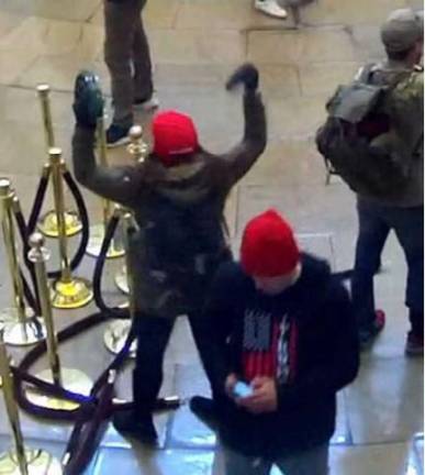 The FBI said this video of a tambourine waving woman in the Capitol Rotunda on Jan. 6 was Sara Carpenter, a former NYPD officer. The single mom is a one-time art student at Marymount College. Photo: US Justice Dept.