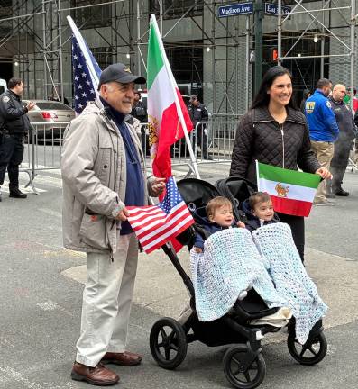 Persian Day Parade on Madison Avenue, April 19, drew two happy kids in a stroller.