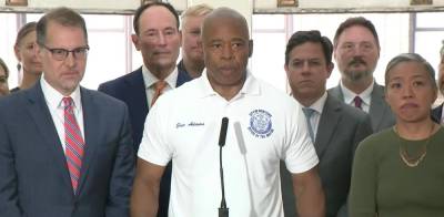 Eric Adams speaking at an August 17 press conference on his tripartite plan to convert a wide swath of unused office space into affordable housing. Manhattan Borough President Mark Levine is to his left.